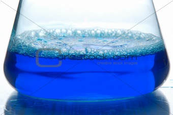 blue liquid in a retort