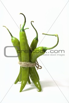 bunch of green hot chilli pepper, tied by rope