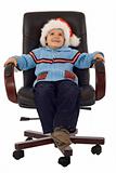 Happy boy waiting santa in a revolving armchair - studio shot