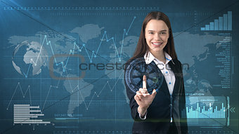 Beautiful business woman in suit is pushing an invisible button, business concept background