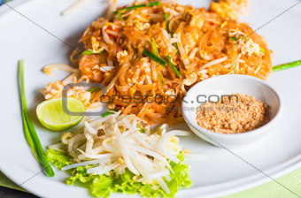 Traditional Thai dish noodles with seafood with beans on a plate