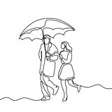 Couple walking under umbrella.