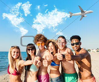 Group of friends having fun on the beach. Concept of summertime