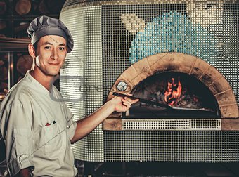 Preparing traditional italian pizza