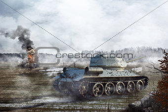 Soviet Tank goes through the swamp in the background of a burning tank