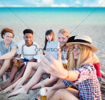 Happy group of friend makes a selfie with a mobile phone