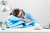 Concept - overtime in the office, tired accountant in the report