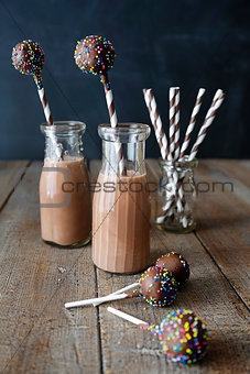 Bottles of chocolate milk with cake pops