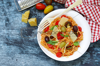 Spaghetti pasta with tomato sauce and olives