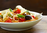 Spaghetti pasta with tomato sauce and olives