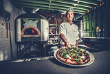 Preparing traditional italian pizza