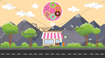 donuts store business on beside street with mountain view as background