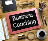 Business Coaching - Text on Small Chalkboard. 3D.