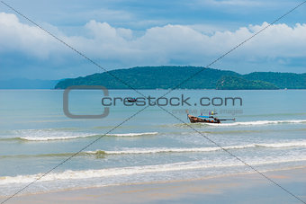 Wooden Thai boats in the pure Andaman Sea. Seascape