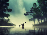 Man kayaking on a lake wild