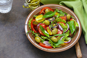 Mediterranean salad with olives, red onions and tomatoes