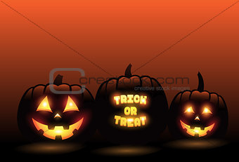 Vector carved pumpkins in front of orange gradient halloween background