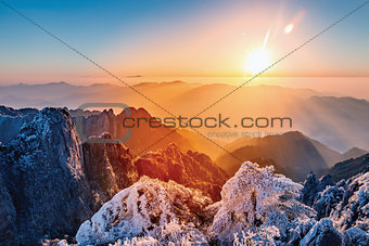 Sunrise above the mountain peaks of Huangshan National park.