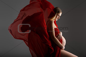 Pregnant girl in red dress