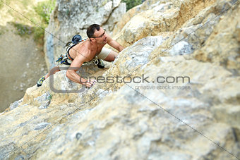 man rock climber on the cliff