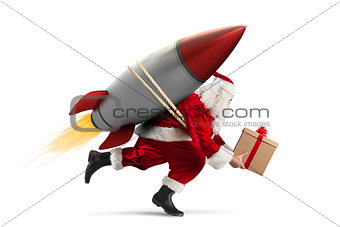 Fast delivery of Christmas gifts ready to fly with a rocket isolated on white background