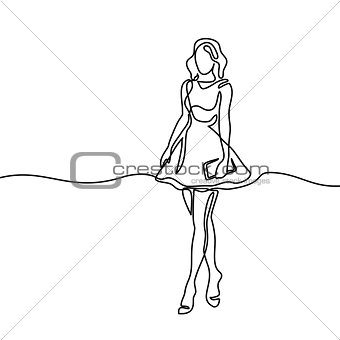 Silhouette of slender woman in short dress