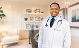Young African American Doctor or Nurse Standing in His Office