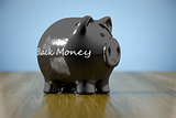 piggy bank with the word black money