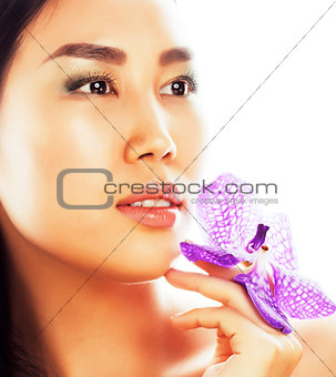young pretty asian woman with flower orchid close up isolated sp