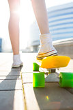 Girl with penny skateboard shortboard.