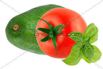 Isolated tomato with basil leaves and avocado