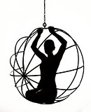 Silhouette of a sexy woman on a metal swing, black and white