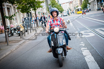 Scooter driver in the streets of Berlin