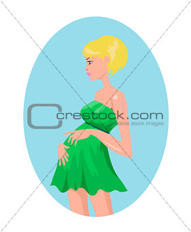 Pregnant blond woman in green dress