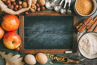 Empty chalkboard and ingredients for baking