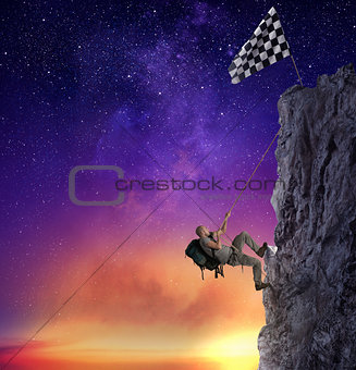 Businessman climb a mountain to get the flag. Achievement business goal and difficult career concept