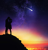 Lovers kiss under the starry sky