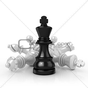 Black king standing over fallen black chess pieces