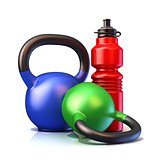 Red plastic sport bottles and kettle bells weight