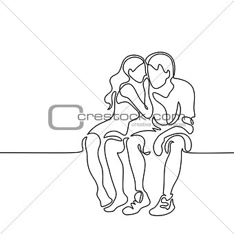 Young couple in love sitting