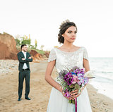 wedding couple, groom and bride in wedding dress near the sea at the seaside