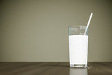 a glass of milk with a straw