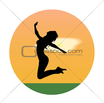 Silhouette of a young girl jumping at sunset