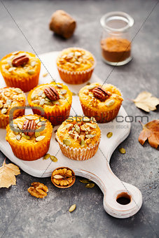 Freshly baked pumpkin muffins with pecans.
