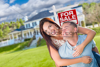 Playful Excited Military Couple In Front of Home with For Sale R