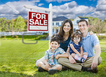 Young Family With Children In Front of Custom Home and For Sale 