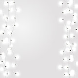 White garland style Christmas lights on the gray background. Vector design elements with dcorative incandescent lamps.