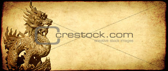 Grunge background with paper texture and vietnamese dragon statu