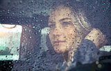 Beautiful sad woman in the car