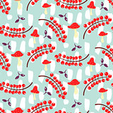 Red currant and amanita on blue seamless vector pattern.
